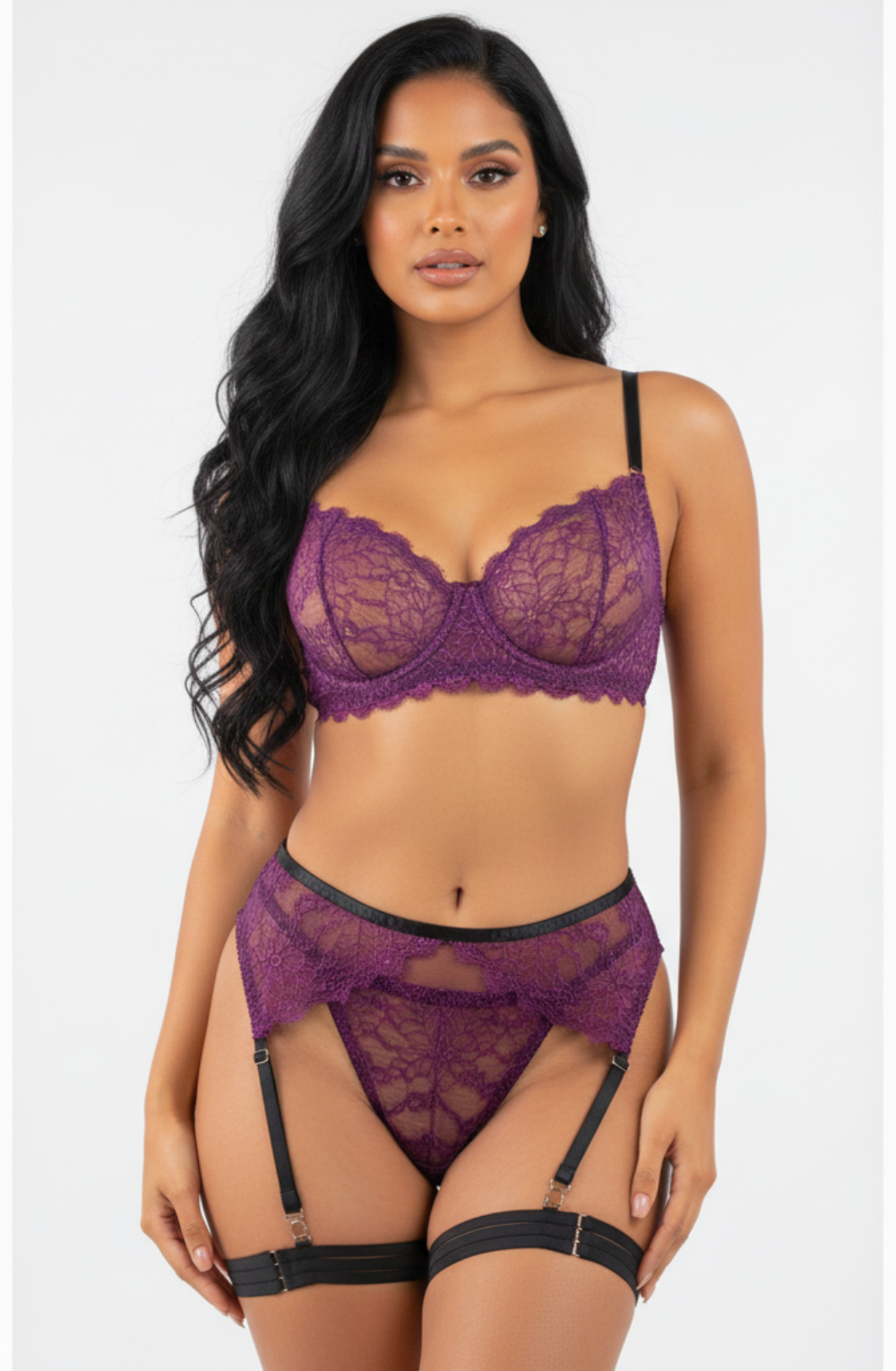 Woman wearing a purple lace lingerie set on a white background