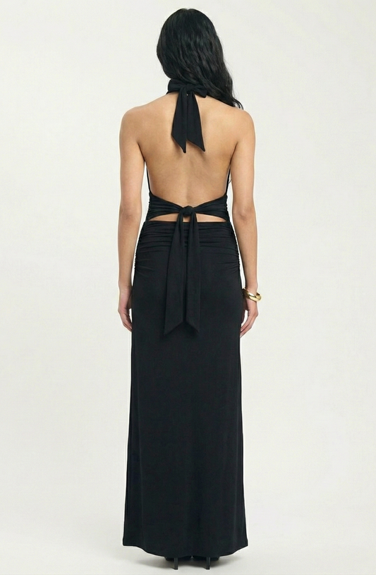 Black halter neck dress with open back on a white background